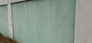 Painting exterior wall of Little League Stadium